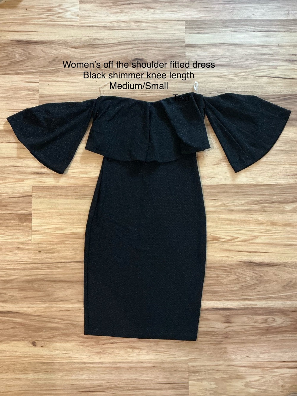 Women’s black shimmery off the shoulder dress